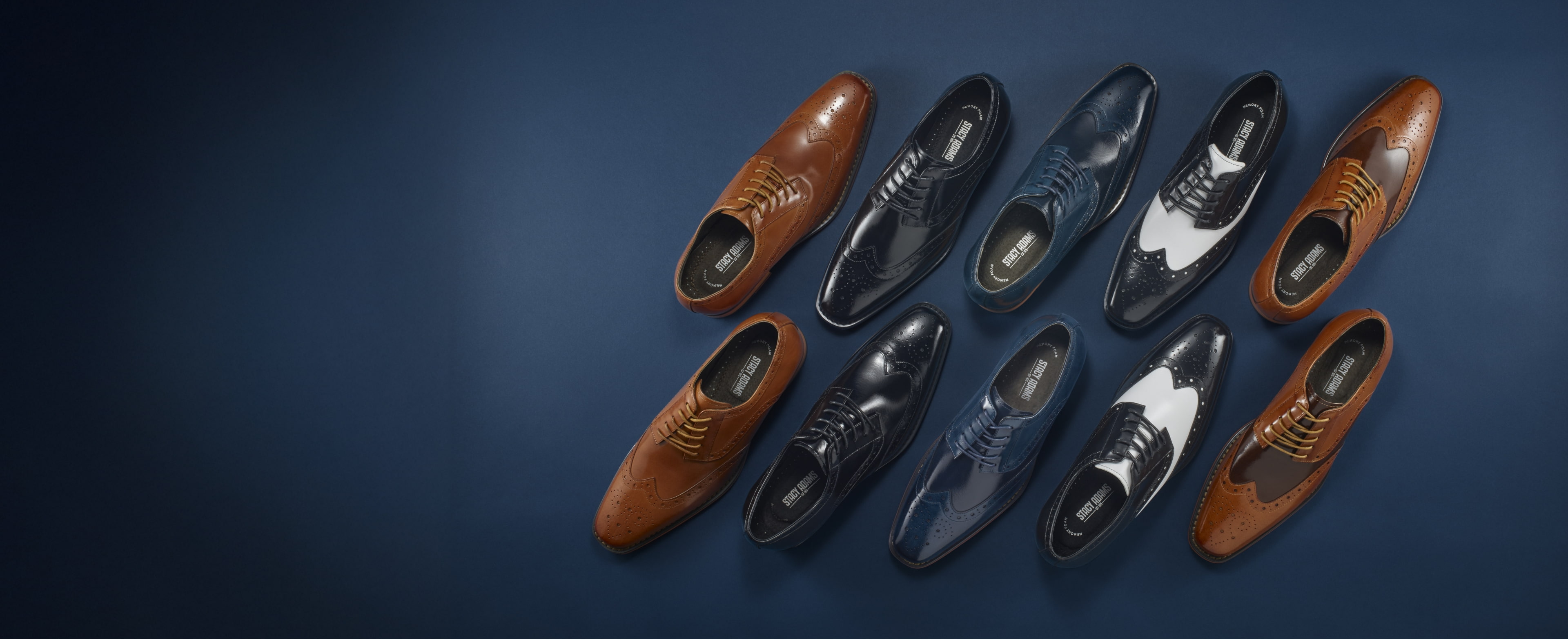 Buy one, get one 50% off men's shoe styles featuring a variety of Stacy Adams dress shoes on a blue background.