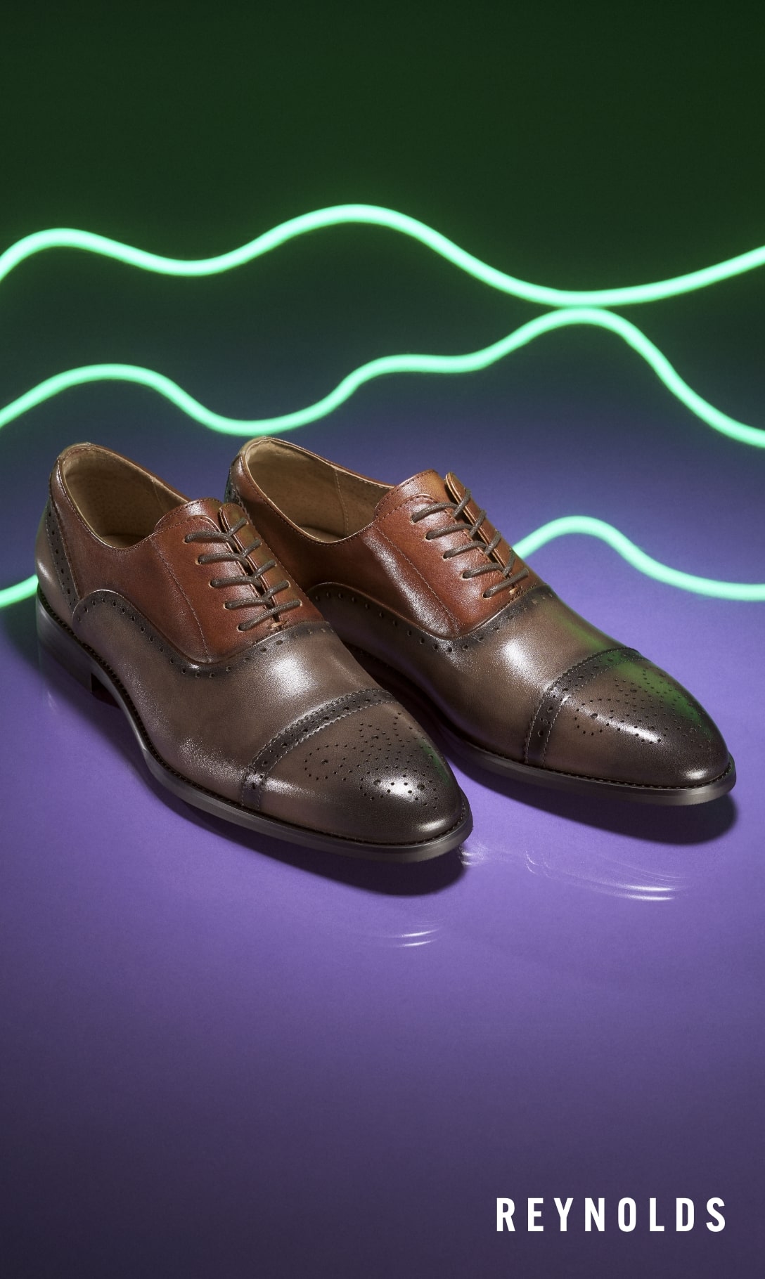 Men's Dress Shoes category. Image features the Reynolds oxford in gray/cognac. 